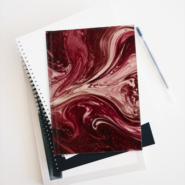 Sunday Theory maroon marble ruled journal with a matte finish and swirled burgundy and cream abstract pattern.