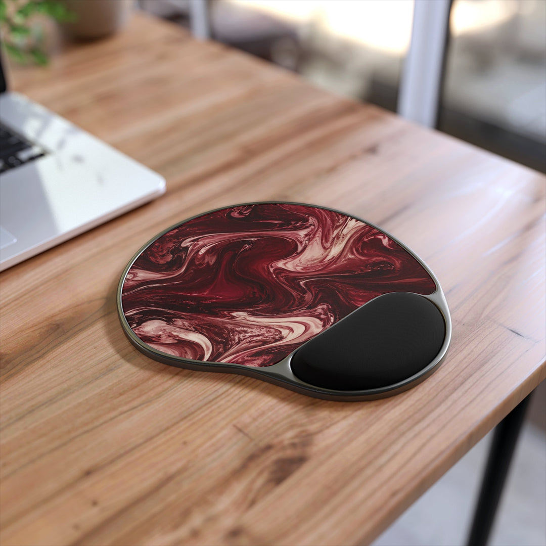 Sunday Theory maroon marble mouse pad with ergonomic black memory foam wrist rest on a wooden desk