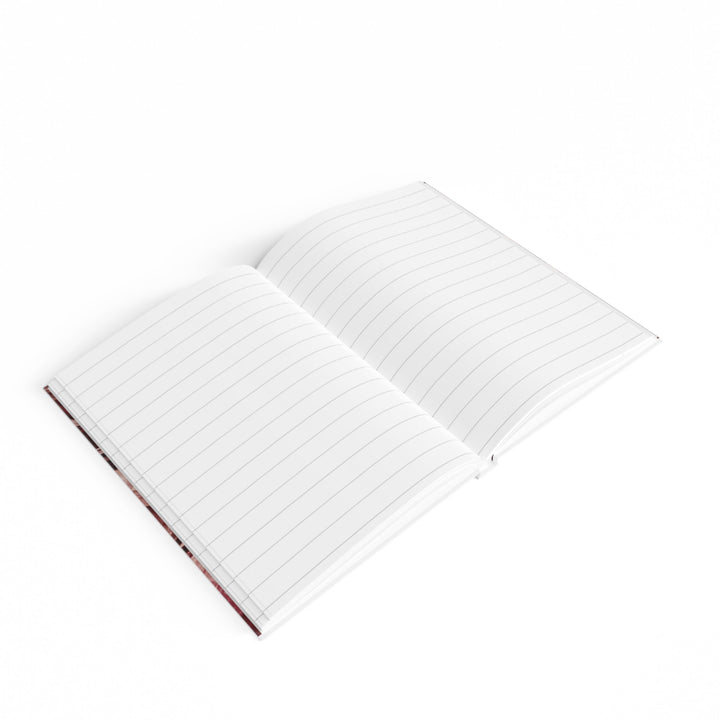 Sunday Theory open ruled journal with white lined pages and a maroon marble cover lying flat on a white background