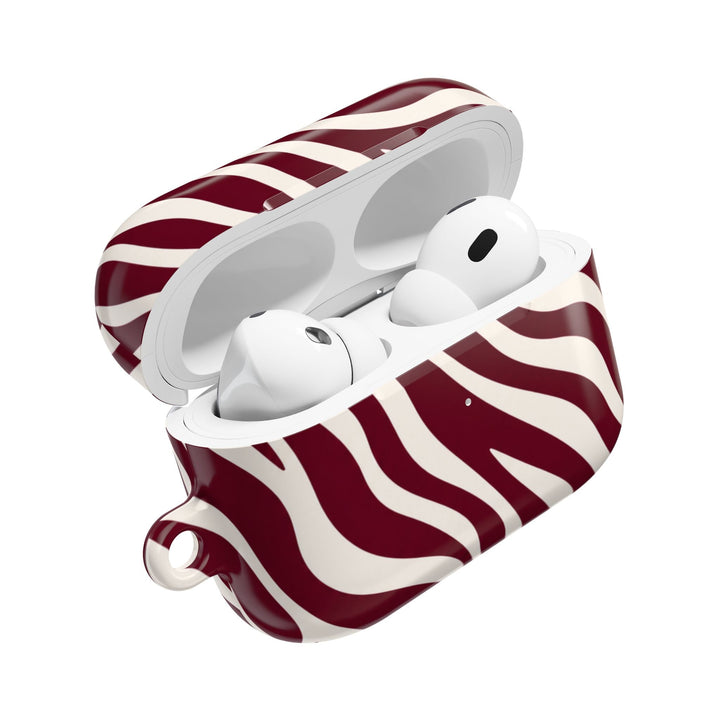 Sunday Theory maroon and cream zebra stripe polycarbonate AirPod case with a glossy finish and open lid