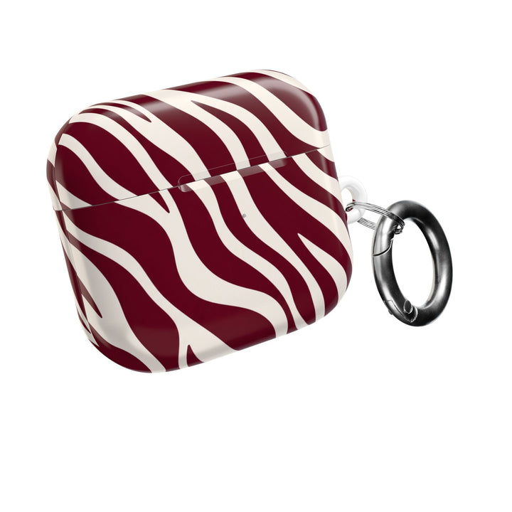 Sunday Theory maroon and cream zebra stripe polycarbonate AirPod case with a silver carabiner clip.