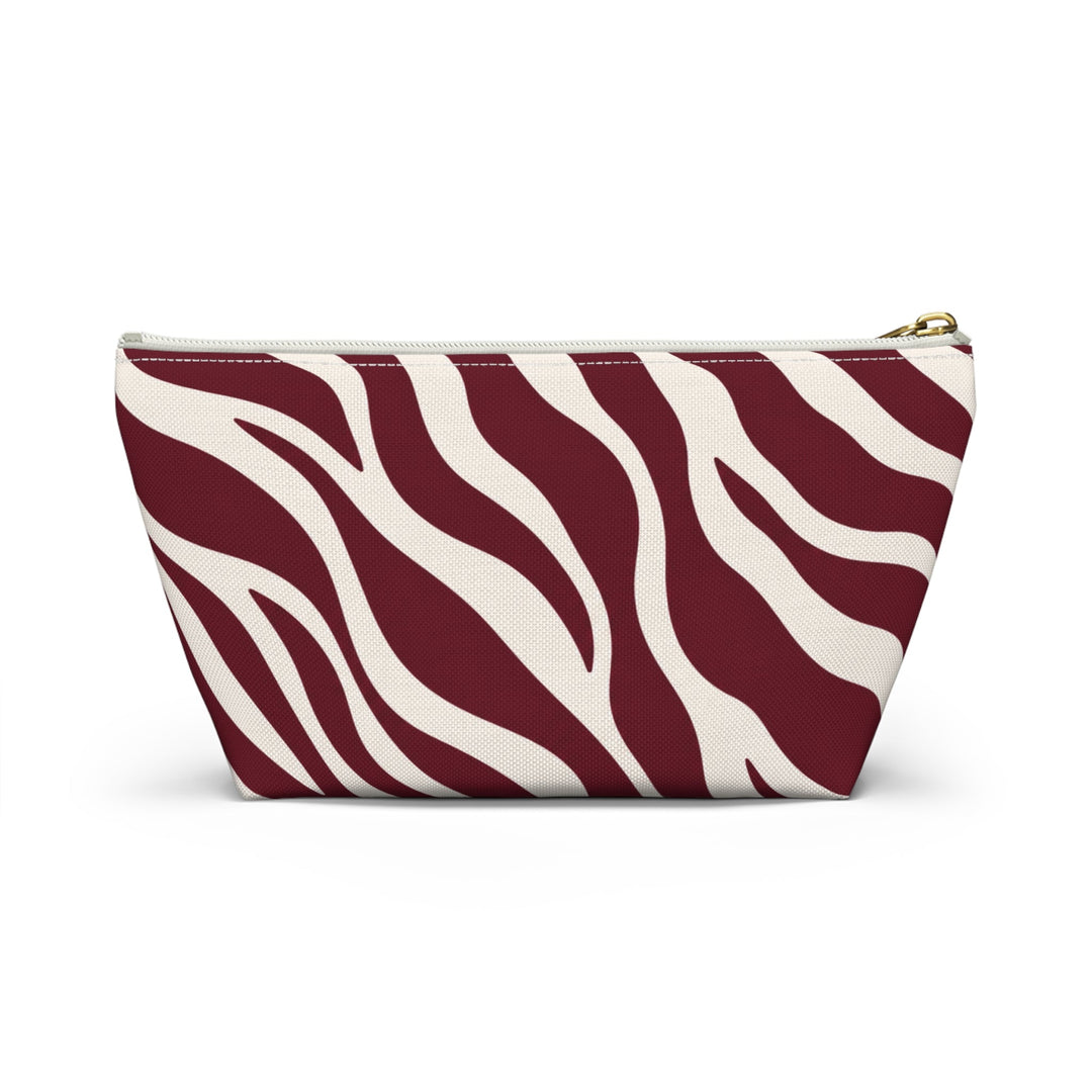 Sunday Theory maroon and cream zebra print accessory pouch with gold zipper closure