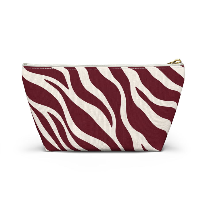 Sunday Theory maroon and cream zebra print accessory pouch with gold zipper closure
