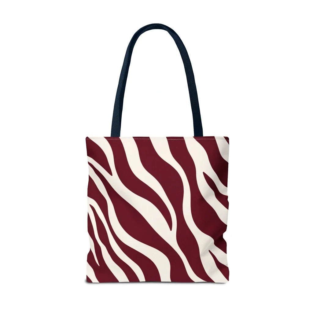 Sunday Theory maroon and cream zebra print tote bag with dark navy shoulder straps against a white background.