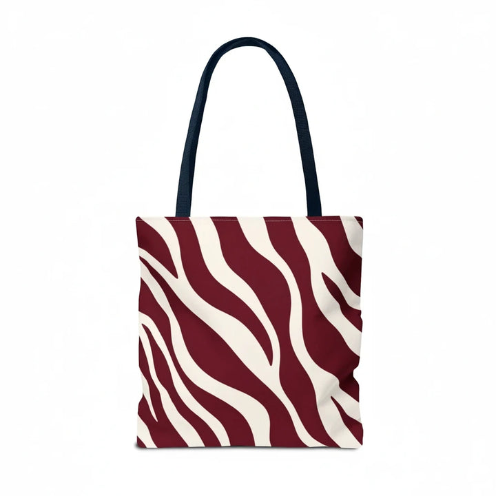 Sunday Theory maroon and cream zebra print tote bag with dark navy shoulder straps against a white background.