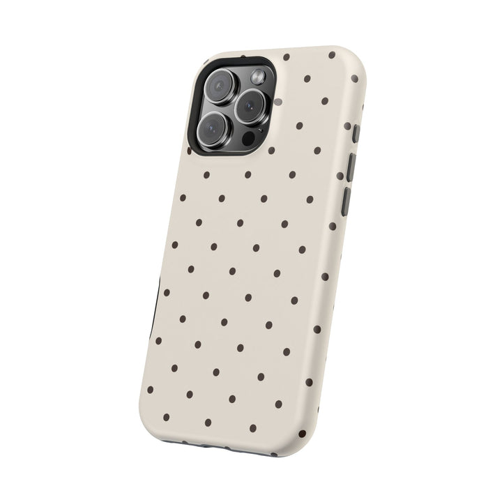 Sunday Theory cream phone case with dark brown polka dots, featuring magnetic impact-resistant design.