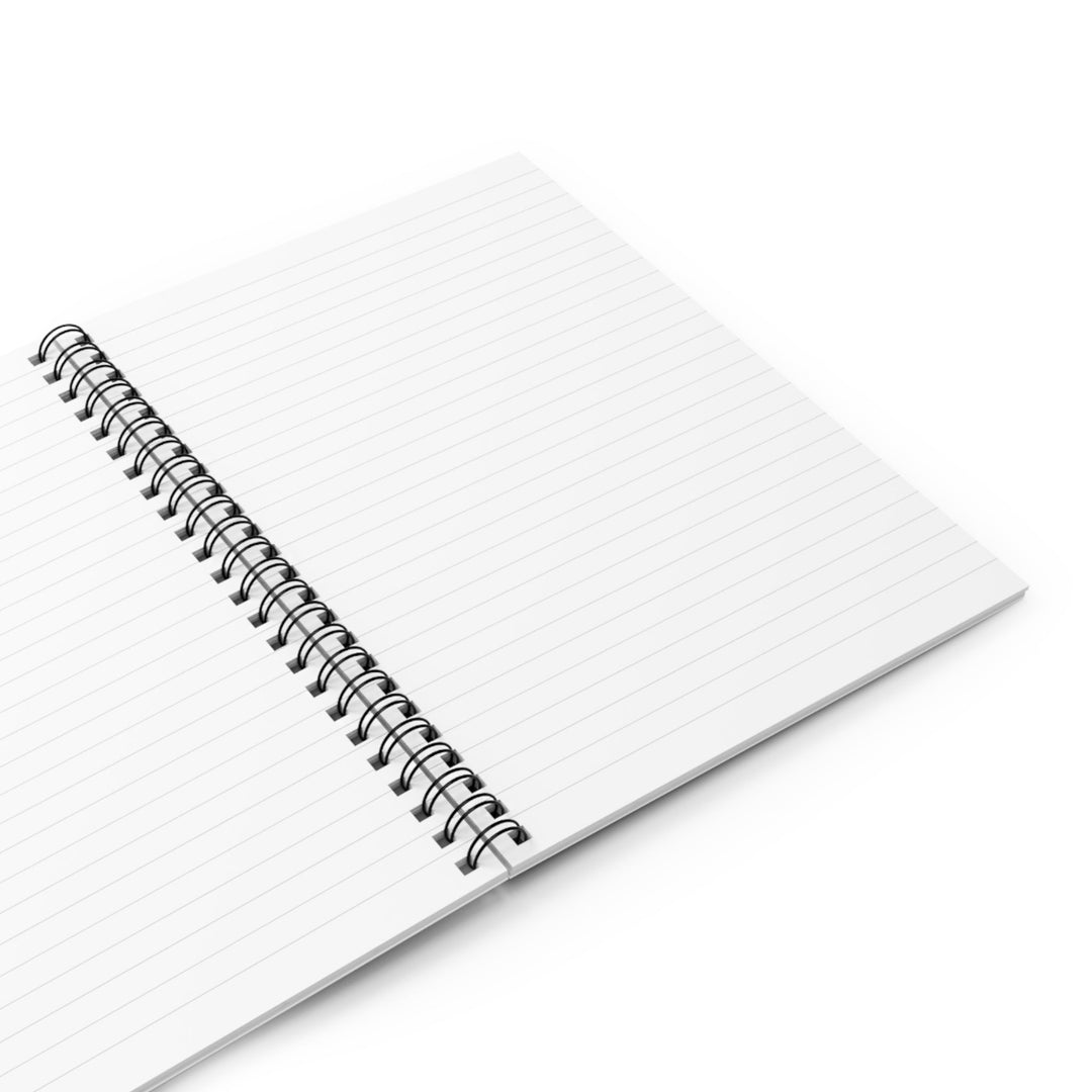 Sunday Theory spiral notebook with open white ruled pages and black metal wire binding on a clean white background
