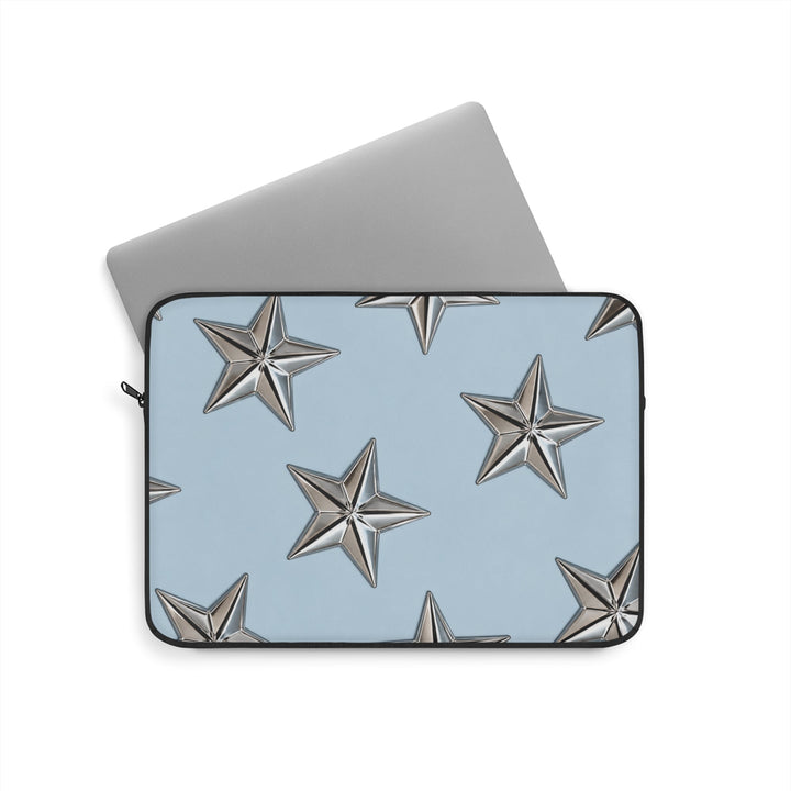 Sunday Theory sky blue laptop sleeve with raised metallic star pattern and plush interior for device protection