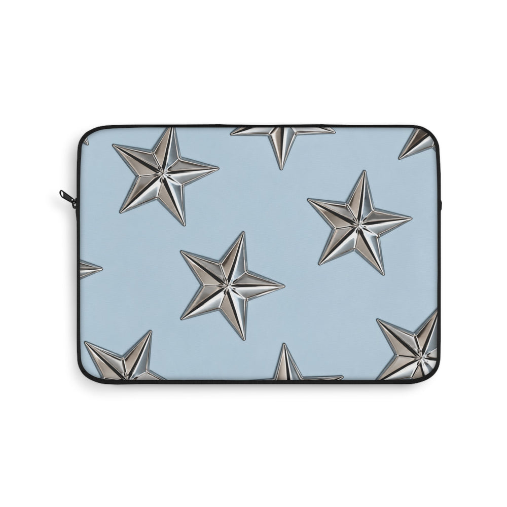 Sunday Theory sky blue laptop sleeve featuring a pattern of raised metallic silver stars and a black zipper trim.