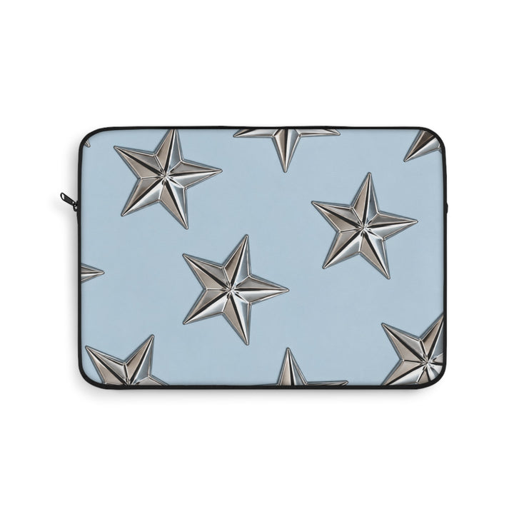 Sunday Theory sky blue laptop sleeve featuring a pattern of raised metallic silver stars and a black zipper trim.