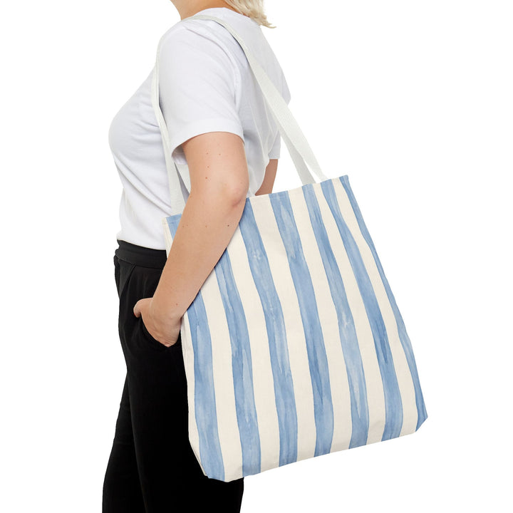 Sunday Theory striped blue watercolor canvas tote bag with white cotton handles worn over the shoulder
