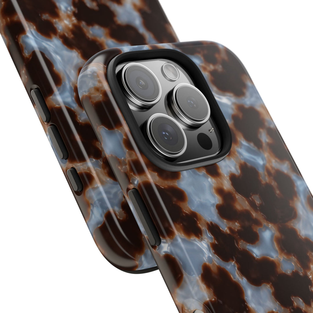 Sunday Theory tortoiseshell phone case with glossy brown and blue pattern and protective camera bezel