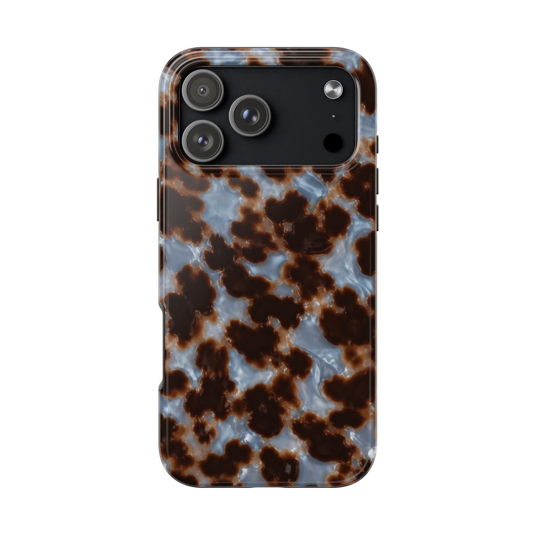Sunday Theory tortoiseshell phone case with a glossy brown and smoky blue pattern and protective camera cutout.