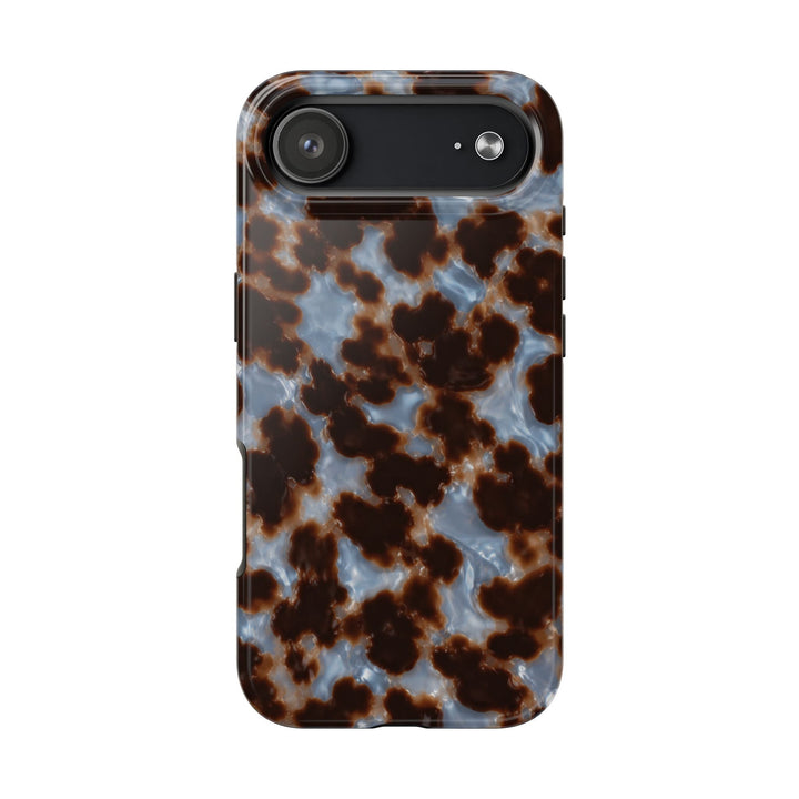 Sunday Theory protective phone case featuring a glossy brown and blue tortoiseshell pattern with a durable finish.